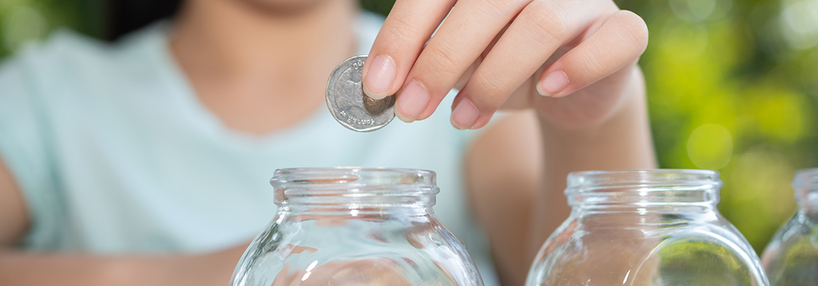 Putting coin in a jar